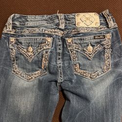 Three pairs of miss me jeans one is a 29 inch waist boot cut, one is a 29 skinny jean and the other one is a 30 inch waist, slim boot cut