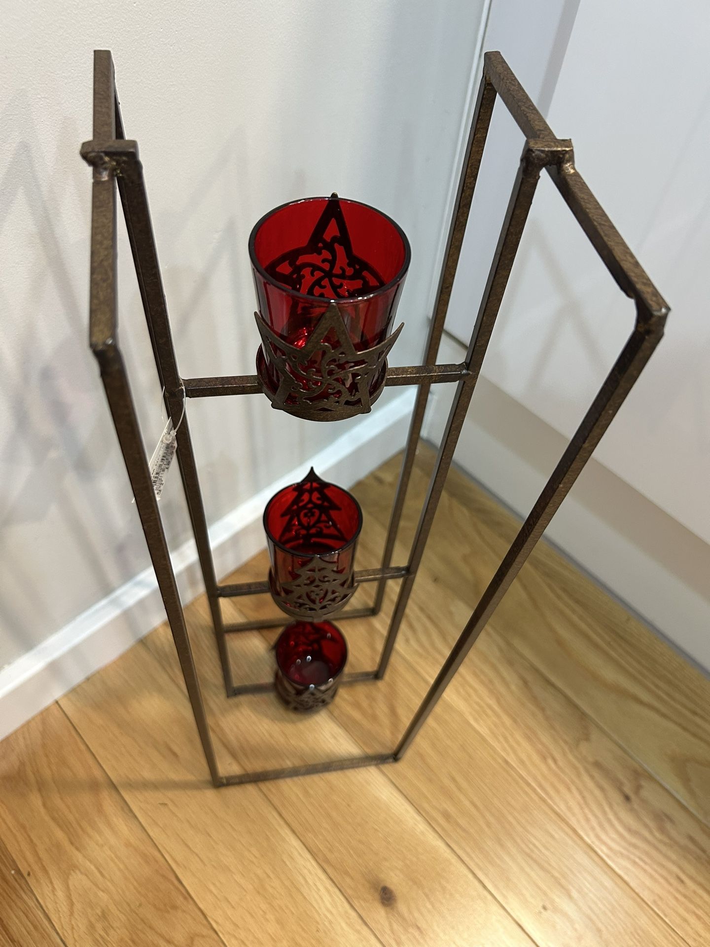 Three-tier metal floor candle