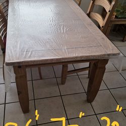 Solid wood dining table with four chairs