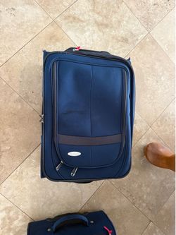 Navy blue samsonite carry on suitcase