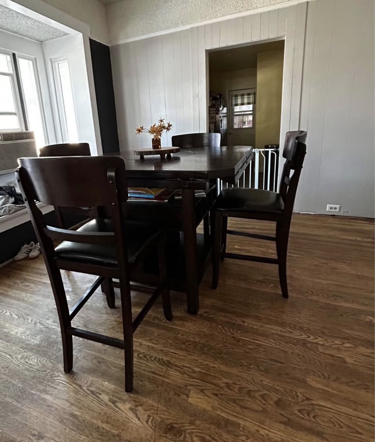 Counter-height dining table with built-in wine rack, drop leaf, and a convenient lazy Susan.