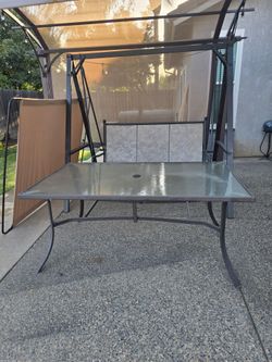 Outdoor swing and patio table