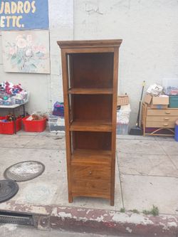narrow wooden bookcase