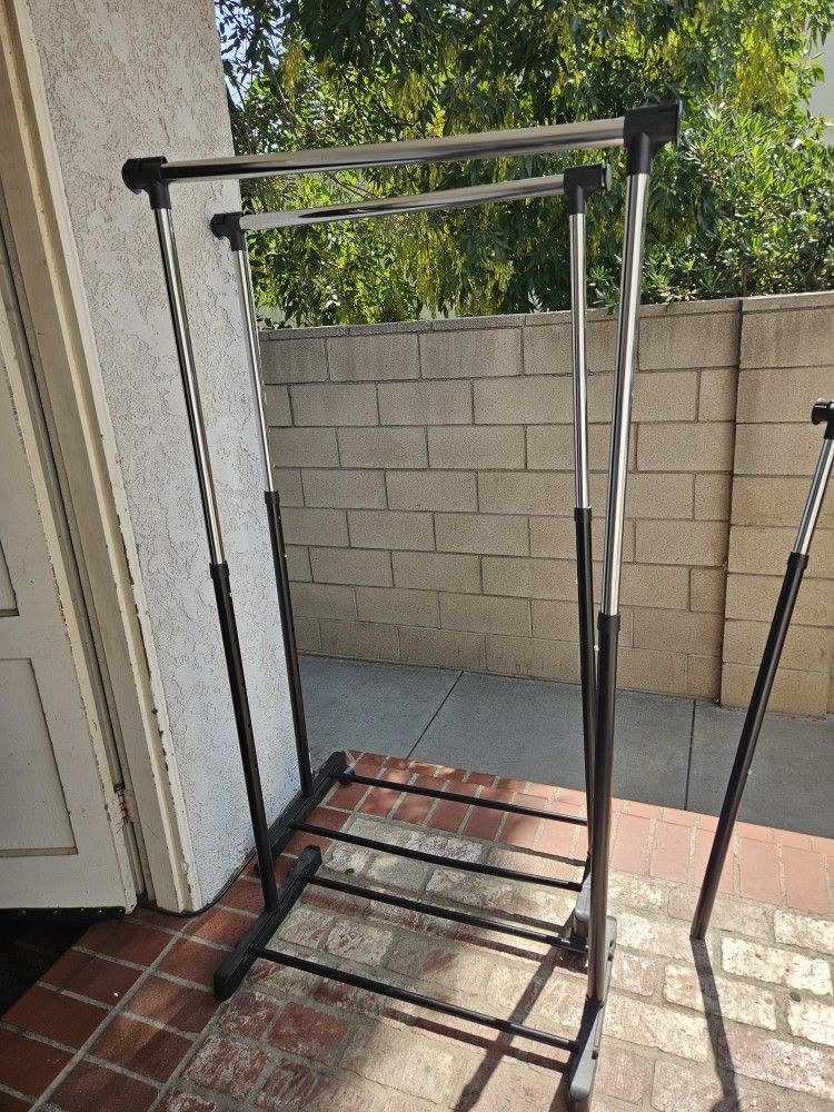 Two Portable Adjustable Clothing Racks