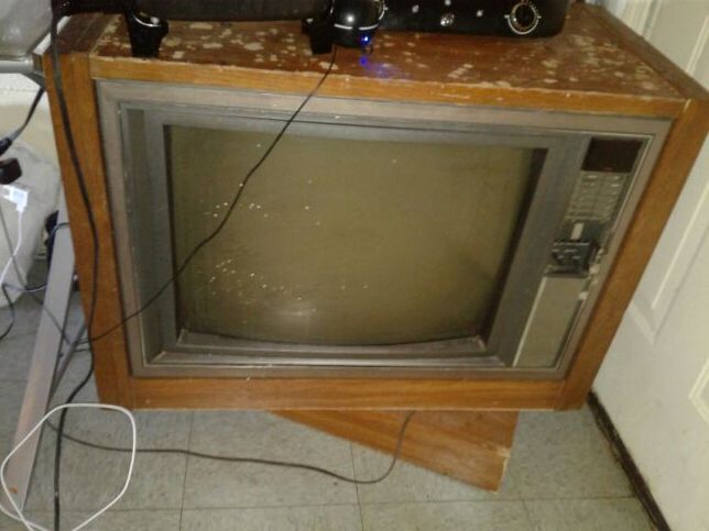 Old floor model tv that shows