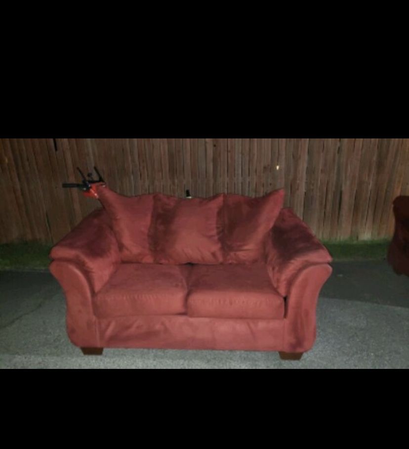Red suede sofa and loveseat
