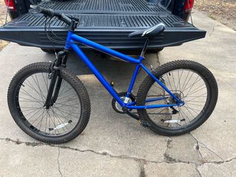 A 26-inch Huffy mountain bike with a rugged design or oversized style typically corresponds to popular entry-level models such as the Huffy Rock Creek