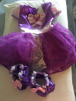 Rapunzel costume with shoe covers.