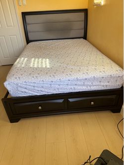 Dark wood queen bed frame with two storage drawers with mattress