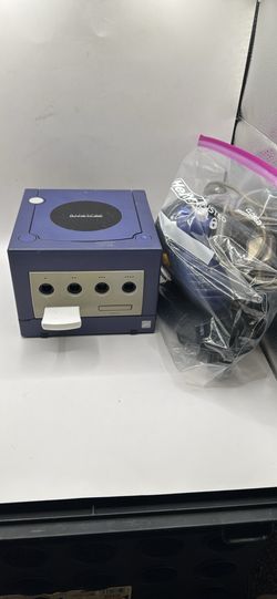 NINTENDO GAMECUBE JAILBRKN WITH SAVED GAMES IN IT. DISK DRIVE WORKS COMES WITH ALL CABLES AND ONE CONTROLLER