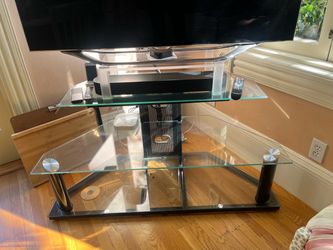 Glass TV entertainment stand. 48” wide 3 shelves