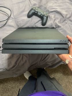 Sony PlayStation 4 with games and controller