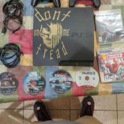 PS3 With Two Controllers Cords And Games 