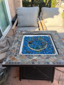 Patio furniture seats 4 with fire pit and propane tank and cover