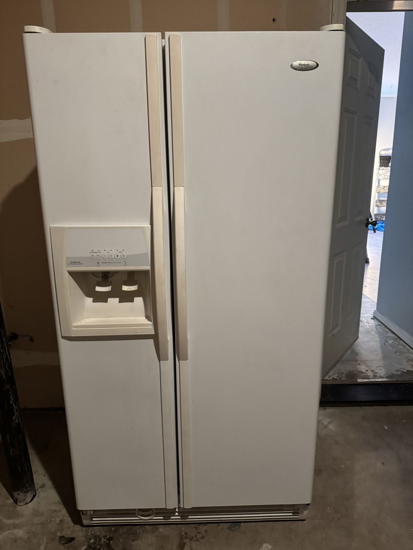 Whirlpool Side By Side Refrigerator.