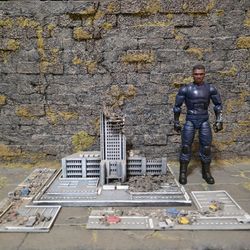 Miniature buildings, streets, and tanks.
