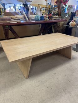 modern light wood coffee table w/ a minimalist design - 58” x 32” 