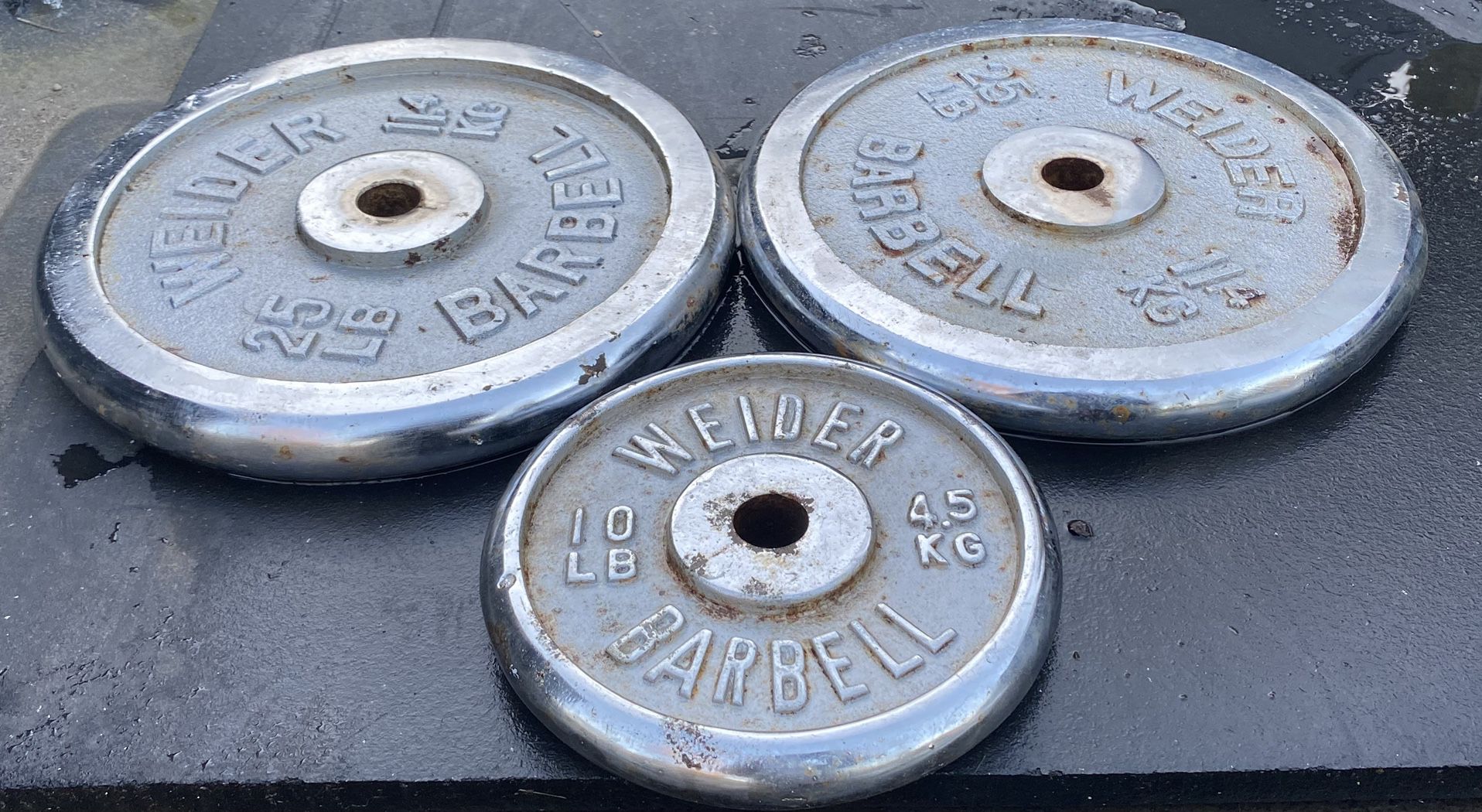 2-25 Lb & 1-10lb Chrome Weider Barbell Plates 