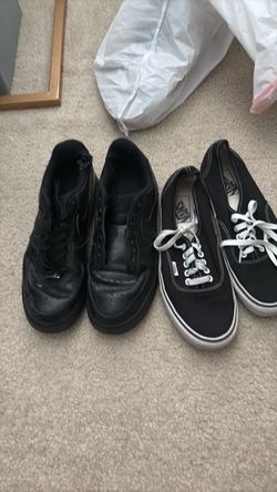 Two Pairs of Black Sneakers Nike and Vans