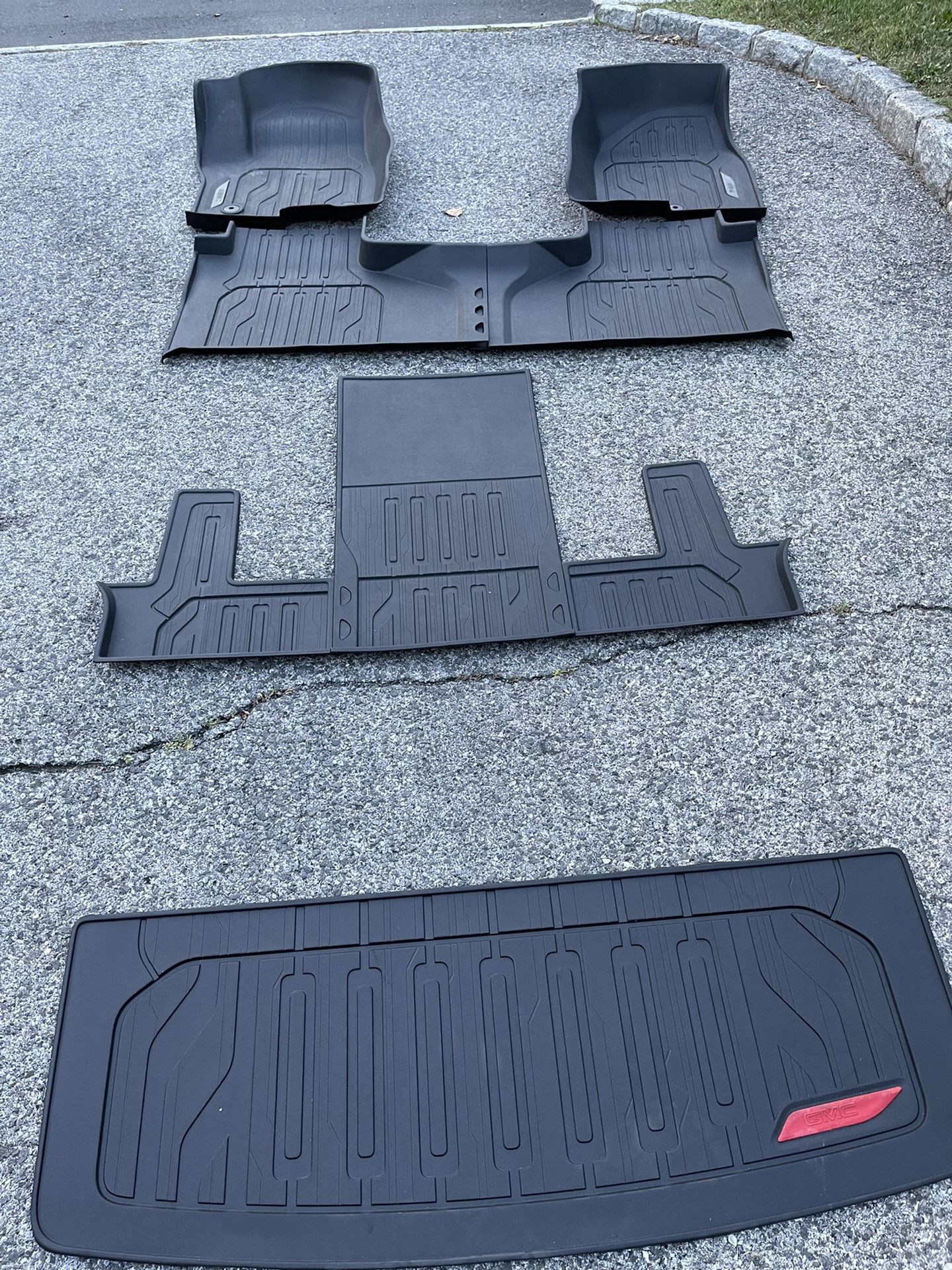 2021 GMC Yukon Denali Complete Floor mat set. All 3 rows plus the rear cargo area. Like new a few months old. 