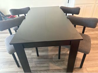 BLACK WOODEN TABLE / GRAY CARPET LIKE-CUSHIONED CHAIRS