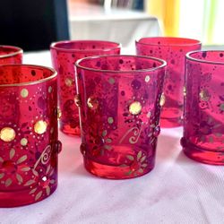 PIER 1 SET OF RED BEJEWELED CANDLE HOLDERS.