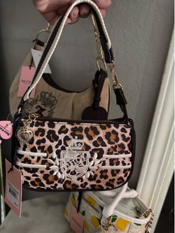 Juicy Couture leopard print wristlet 🐆