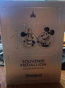 Disneyland souvenir medallion collection book