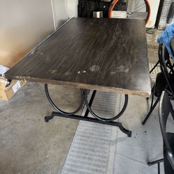 Brown wood rectangular dining table with metal legs