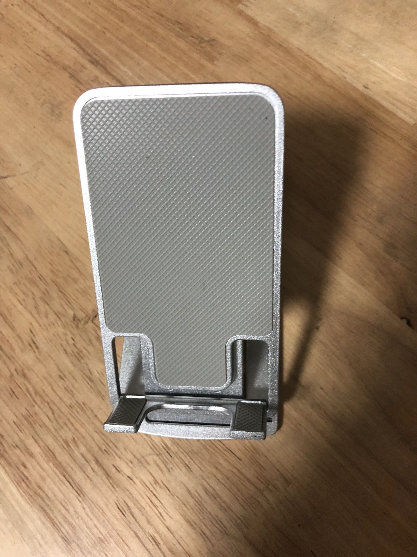 Adjustable foldable phone holder