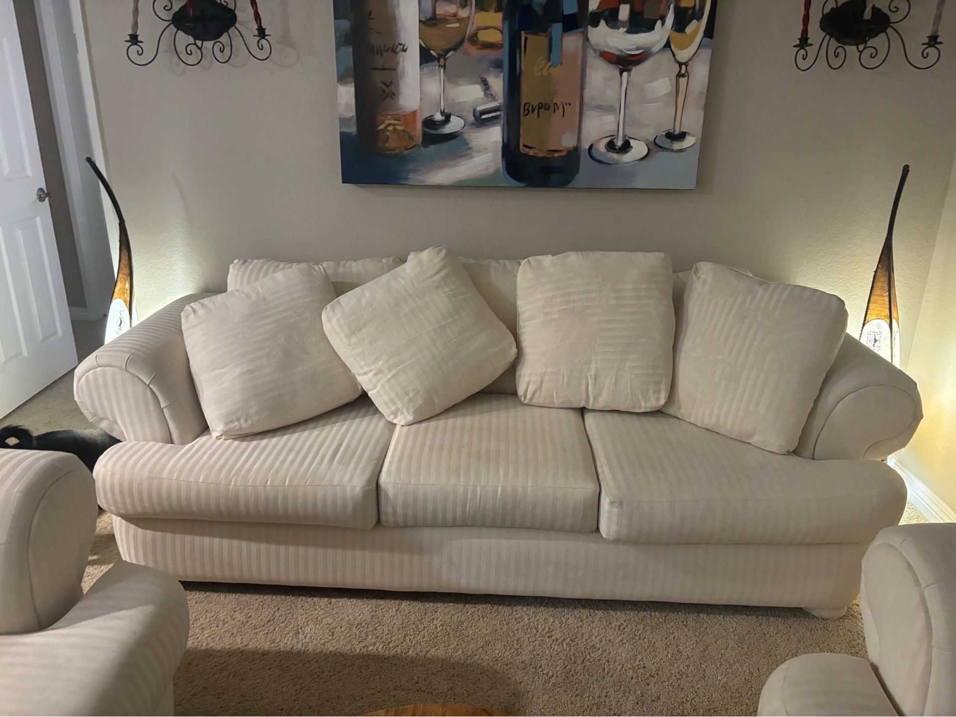 Cream color coach and two matching chairs