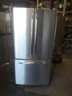 refrigerator brand GE water and internal ice measures 33 wide and 68 high 3 months warranty delivery and installation