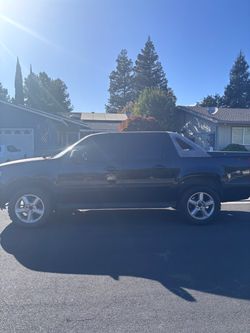 Black Full-Size SUV with Chrome Wheels