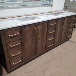 84in Bathroom Vanity With Quartz Top And Sinks Included.  Has Electrical Outlets Inside