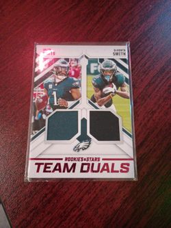 2021 Panini Rookies & Stars "Team Duals" Memorabilia Card, featuring the core of the Philadelphia Eagles' passing game: Quarterback Jalen Hurts and Wi