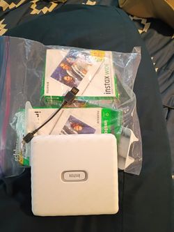 Portable printer with 2 packs of film