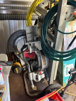 Dewalt 12” dual bevel sliding miter saw on Ridged stand