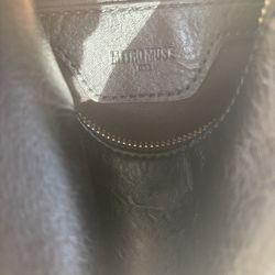 black faux leather Metro Muse backpack with gold overtones