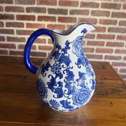 Blue and white floral ceramic pitcher.