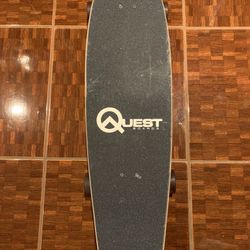 Quest 36” cruiser board skeleton hand holding surfboard design