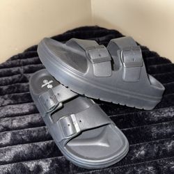 Unisex Sol Borne double-buckle EVA slide sandals. 