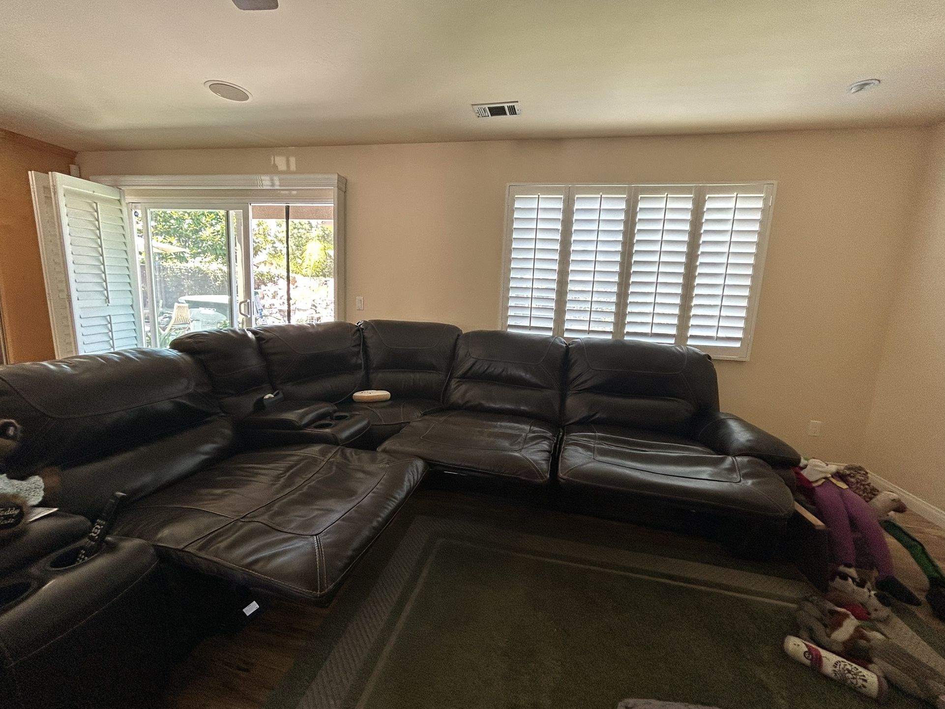 10 x 11 Ft Brown Leather Sofa w (4) Recliners And Storage