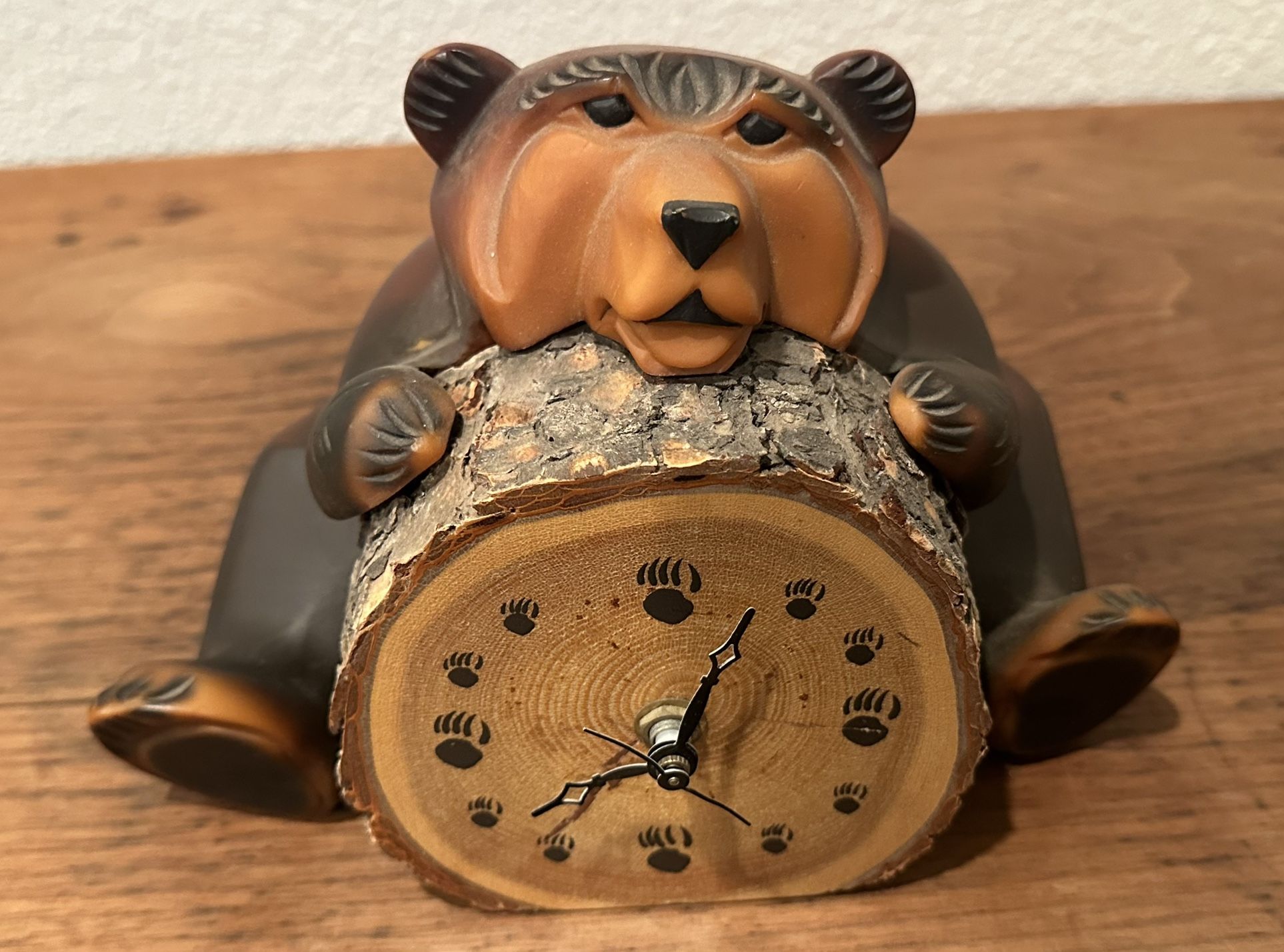 Montana Wax & Wood Bear holding a removable battery operated click