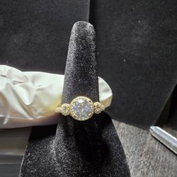 The product is a stunning 10kt gold over 925 silver size 6 ring diamond 