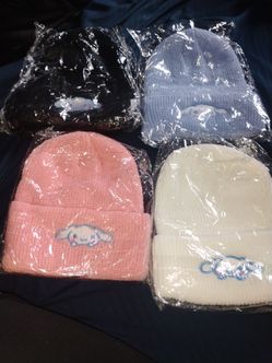 4 beanies they're a blue one pink white black