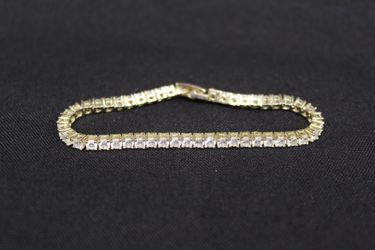 Gold Tone Tennis Bracelet with Clear Rhinestones