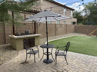 Bistro Patio Table, 2 Chairs and Umbrella.