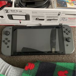 nintendo switch with games and case
