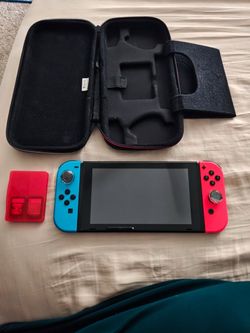 Nintendo Switch with Carrying Case and Game Holder