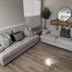 Light gray sofa and loveseat set